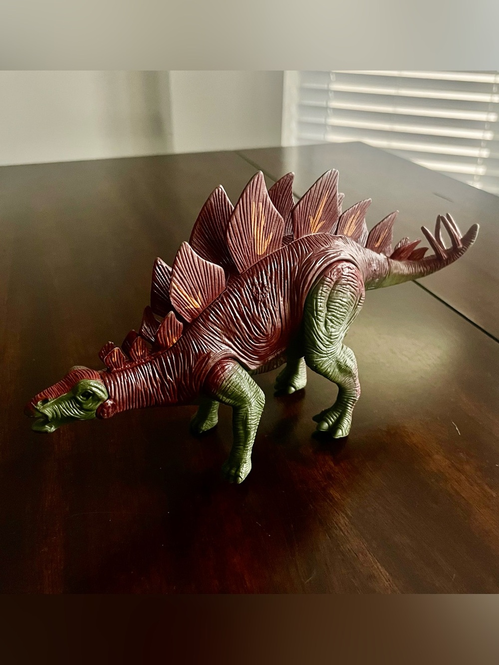 Realistic Stegosaurus Figure in Deep Red and Olive Green